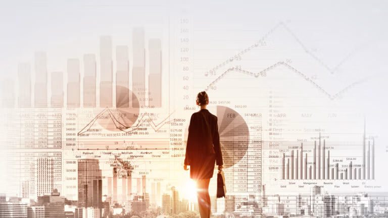 Businesswoman with a briefcase facing a city skyline overlaid with financial charts