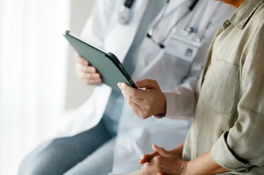 Patient and physician going over medical details