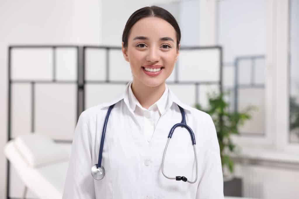 Smiling doctor with a stethoscope in a clinic
