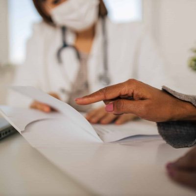 Woman consulting to doctor about her therapy.