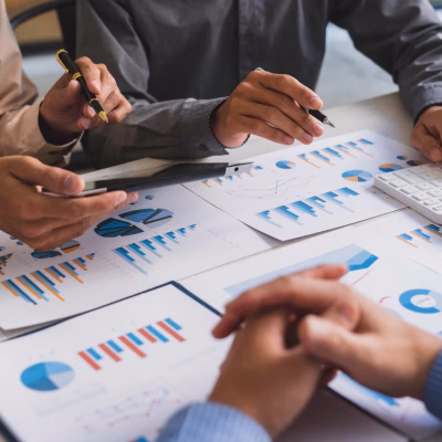 Bookkeeper accountant or financial expert, male economist accounting money with statistics graphs pointing on the accounts for investment results and income Company expenditure