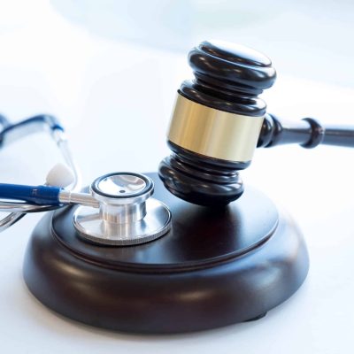 Gavel and stethoscope. medical jurisprudence. legal definition of medical malpractice. attorney. common errors doctors, nurses and hospitals make.